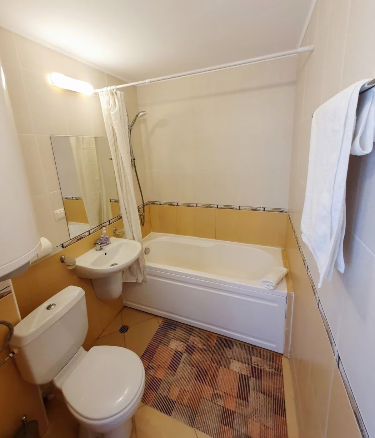 Bathroom with a combination tub and shower
